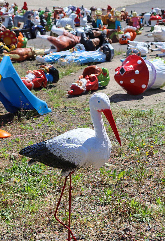 Stork figurine and other toys at the playground